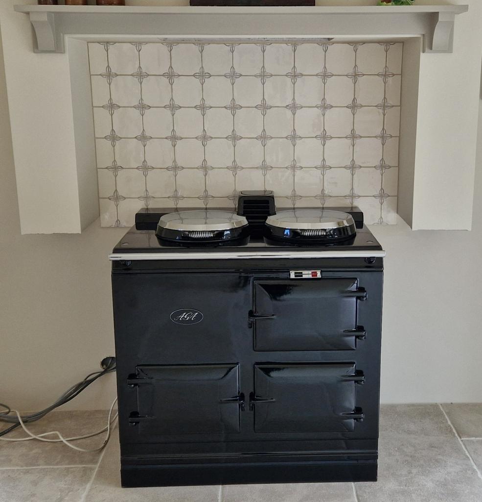 <p>Black 2 Oven Electric Aga Cooker installed in the New Forest</p>